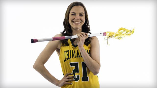 Kaylen Buschhorn poses with a lacrosse stick.